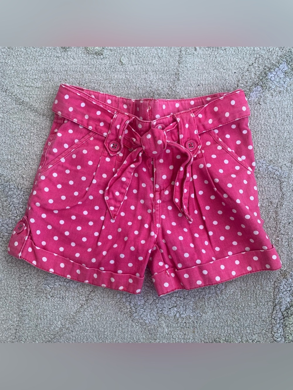 pink shorts with a white polka dot pattern size 4